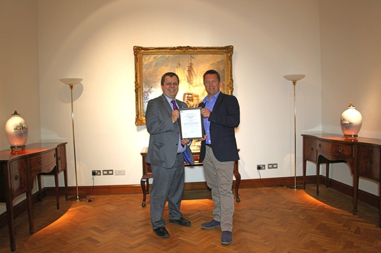 Nick Davis, CEO of GoAGT, receiving ISO/PAS 28007 certificate from David Derrick, LRQA's UK Business Centre Manager