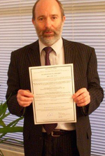 Mike Kennedy, Technical Director, Chiron with certificate