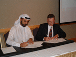 Wes Appleby, MAXxess Systems  and Dr Abdula Mehasime of Emirates Group Security signs the agreement.