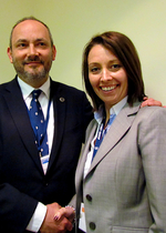 Outgoing Chairman, Mike Bluestone, congratulates Emma Shaw on her appointment as the Security Institute&#39;s new Chairman