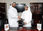 (left) Dr. Abdulla Al Hashimi, divisional senior vice president, Emirates Group Security on behalf of Transguard shakes hands with (right) Mr. Ahmed Bin Sulayem, executive chairman, Dubai Multi Commodities Centre on behalf of Dubai Diamond Exchange