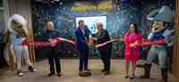 The ribbon cutting ceremony at the new Axis Experience Center in Frisco, Texas.