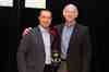 Altronix JR Andrews accepts the award from Bill Bozeman, President and CEO of PSA Security Network