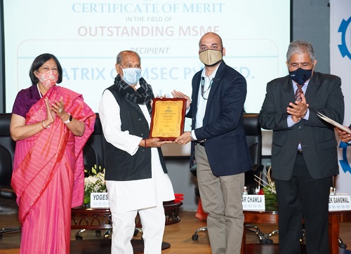 A sign of the times at the masked ceremony -Ashish Shah, Vice President - Human Resources, Matrix Comsec receiving the award from Shri Yogesh Patel, Hon’ble Minister of State – Narmada, Urban Housing, Govt. of Gujara A sign of the times at the masked ceremony -Ashish Shah, Vice President - Human Resources, Matrix Comsec receiving the award from Shri Yogesh Patel, Hon’ble Minister of State – Narmada, Urban Housing, Govt. of Gujara