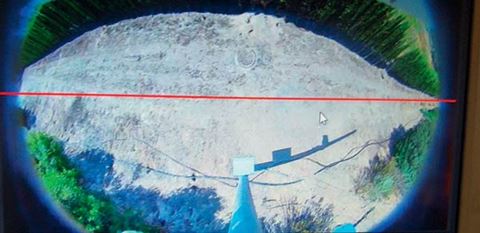 Camera view of area where Lidar detector Optex Redscan Pro monitors long and narrow corridor in perimeter protection. The picture below on the right shows an installation of the same detector, which is able to adapt to the environment and location where it is installed.