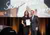 Nicole Huffer, VP Marketing and Comms at Simonsvoss receives award from Andrej Kupetz of the German Design Awards