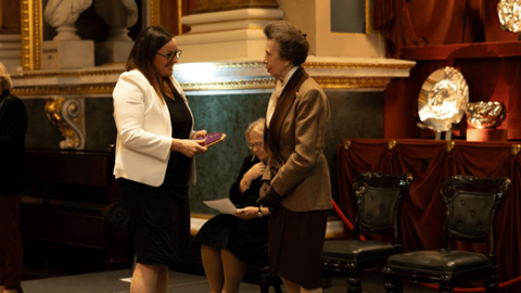 Heather Page, VP Global Learning and Development at G4S accepts the award from HRH The Princess Royal.